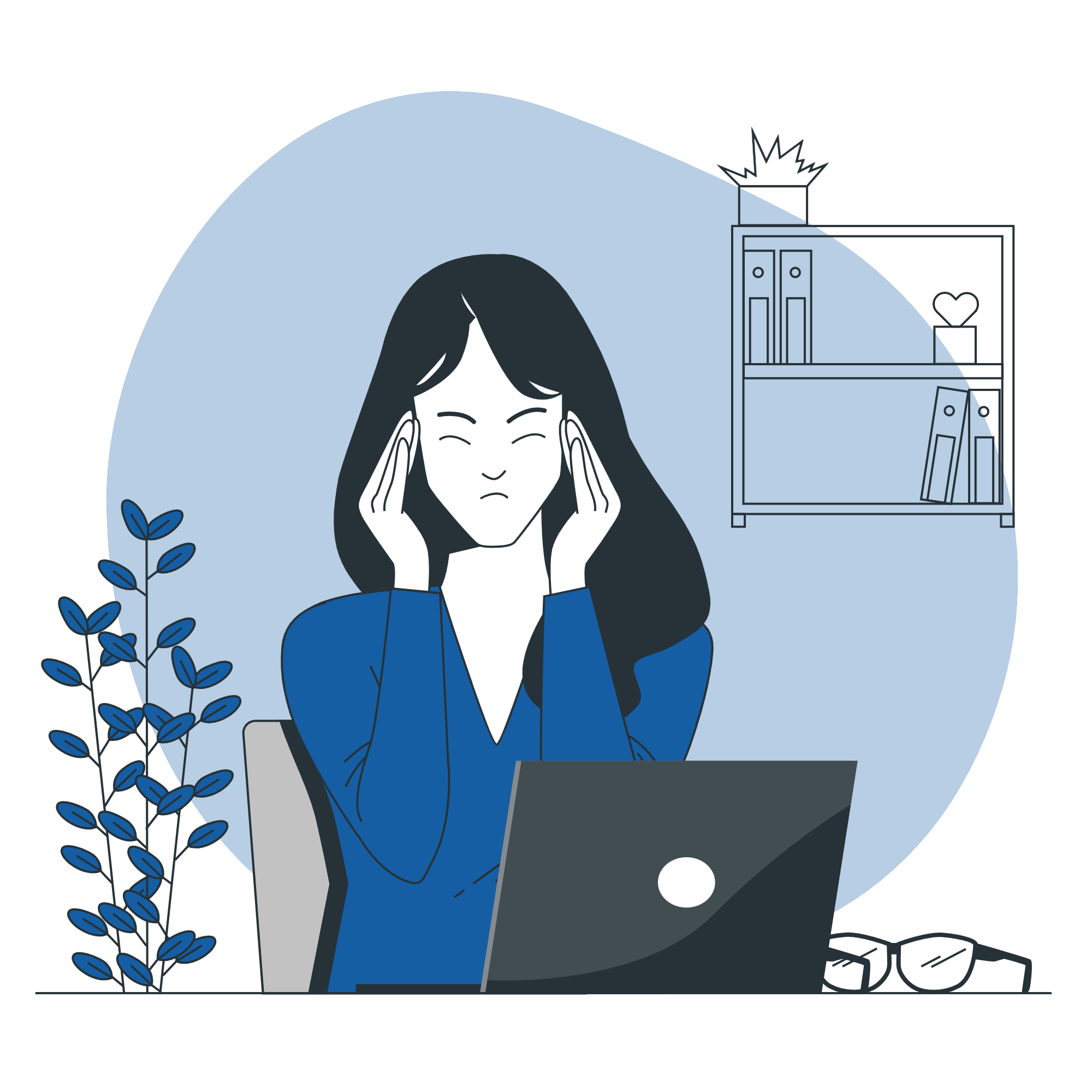 Woman sitting in front of computer with headache